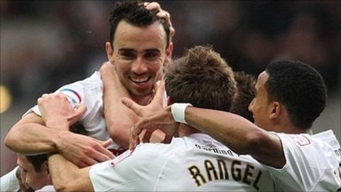 Leon Britton and team-mates celebrate his opening goal