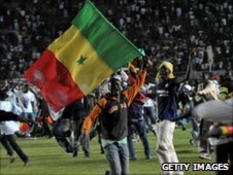 A Senegal fan celebrating