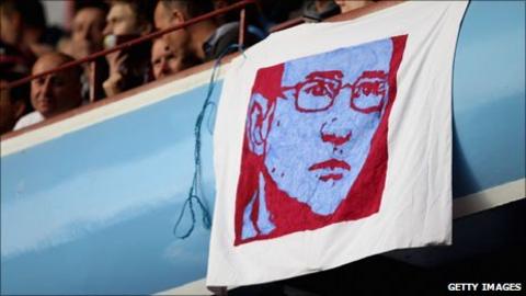 A flag depicting Martin O'Neill is draped over the stands at Villa Park