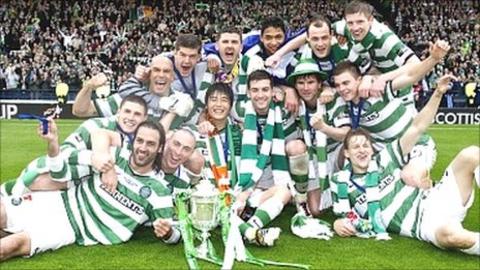 Celtic players celebrate winning the Scottish Cup