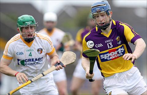 Kevin Molloy of Antrim is left behind as Wexford's Rory Jacob goes on the attack
