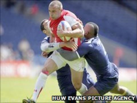 Nicky Griffiths tries to barge through the French defence