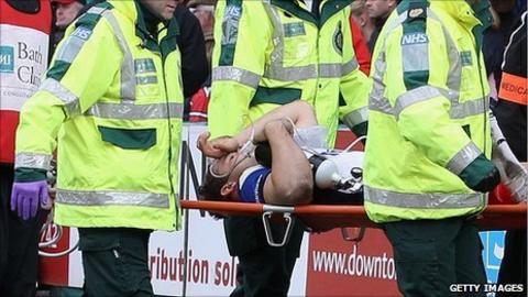 Olly Barkley is stretchered off with a broken leg