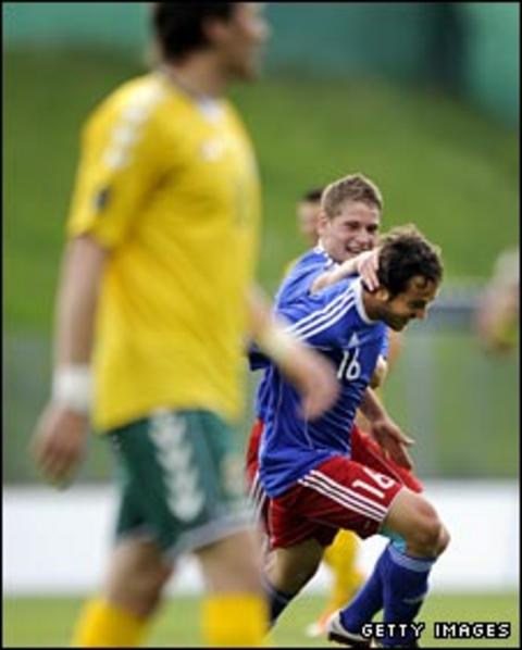 Nicolas Hasler and Philippe Erne celebrate against Lithuania