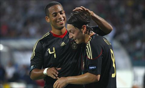 Dennis Aogo (l) and Mesut Ozil celebrate Germany's opening goal