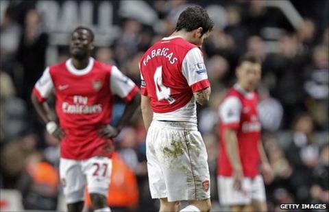 Emmanuel Eboue (left), Cesc Fabreagas and Laurent Koscielny