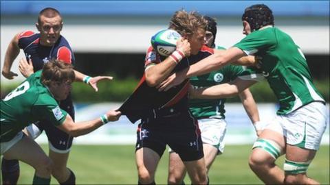 Wales try-scorer Liam Williams is tackled by Iain Henderson and Kieran Marmion of Ireland
