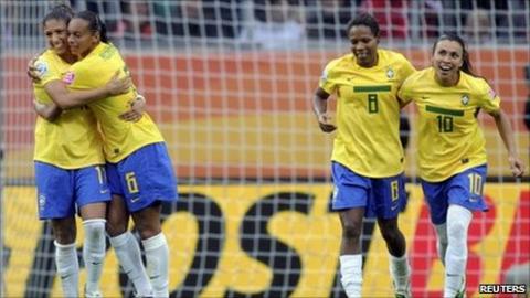 Brazil players celebrate a goal