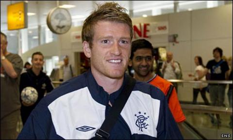 Steven Davis leaves with the Rangers squad