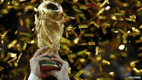 Gerard Pique of Spain holds the Fifa World Cup trophy after the 2010 World Cup final