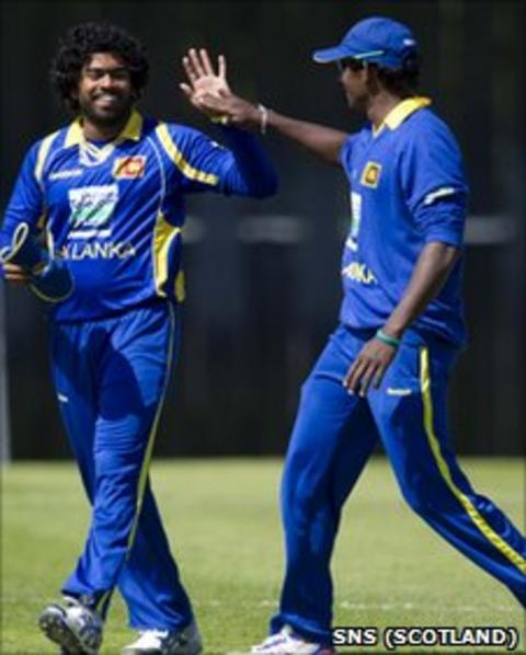 Sri Lanka's star opening bowler Lasith Malinga (left) celebrates another wicket with captain Tillakaratne Dilshan