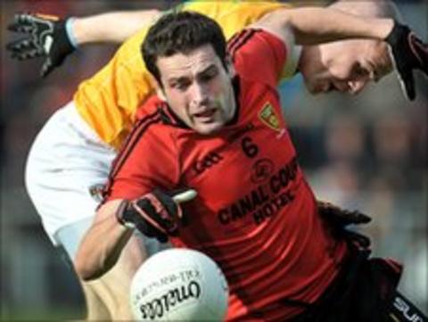 Down's Kevin McKernan moves clear of Aodhan Gallagher in the qualifier