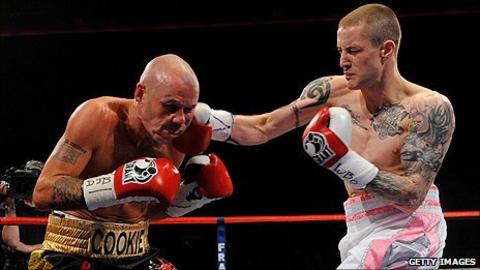 Ricky Burns lands a right on Nicky Cook