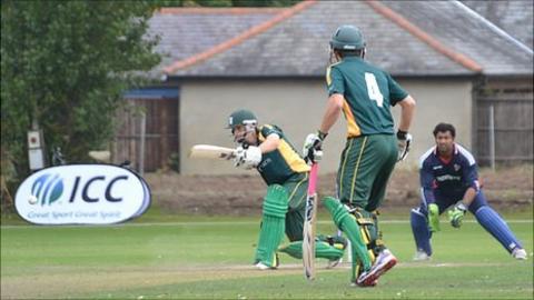 Guernsey cricketer Tim Ravenscroft batting in partnership with Ross Kneller against Norway