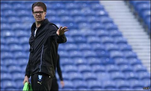 Rikard Norling takes training at Ibrox