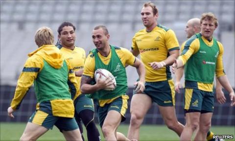 Quade Cooper (c) of Australia and team-mates at Eden Park