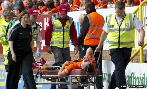 Scott Severin is stretchered off the pitch after sustaining an injury