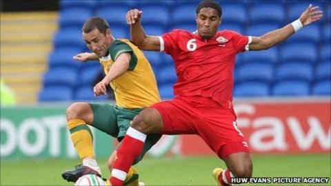 Wales' Ashley Williams and Australia's Scott McDonald compete for the ball