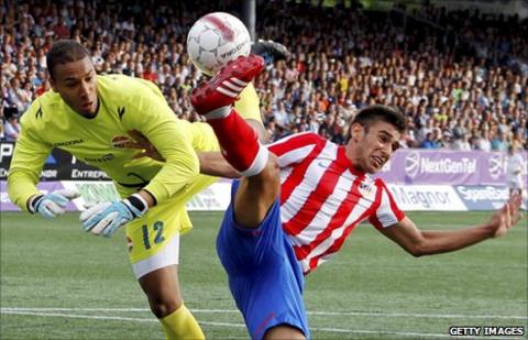 Adam Kwarasey (left) in action for Stromsgodset in 2011