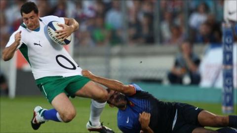 Irish full-back Rob Kearney is tackled by David Marty in Bordeaux