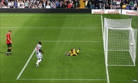 Manchester United goalkeeper David De Gea looks into the net after West Brom's Shane Long (not pictured) scores his side's equaliser