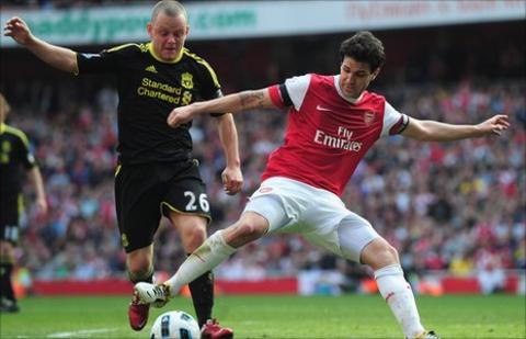 Liverpool's Jay Spearing and former Arsenal midfielder Cesc Fabregas