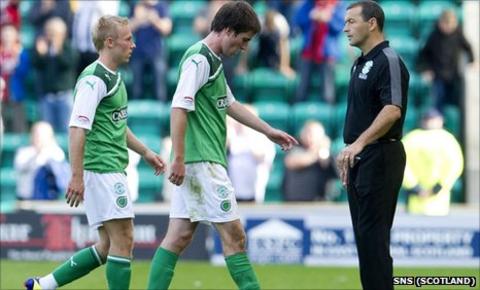 Colin Calderwood watches his players trudge off after defeat to St Mirren