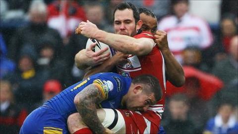 Pat Richards tries to keep hold of the ball