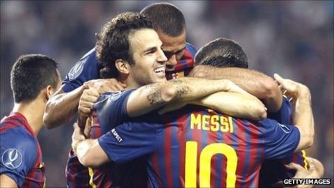 Cesc Fabregas (centre) celebrates his goal with Barcelona team-mates