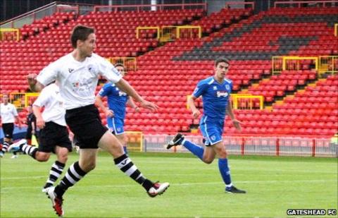 Jon Shaw shoots against Grimsby
