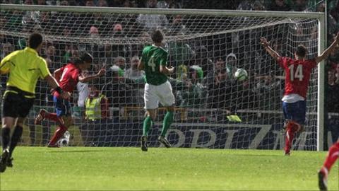 Marko Pantelic (left) celebrates after the ball hits the Northern Ireland net