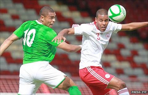 Josh Magennis of Northern Ireland in action against Denmark's Mathias Jorgensen