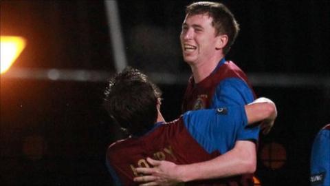Billy Joe Burns celebrates after scoring at the Showgrounds