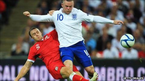 Darcy Blake in action against England's Wayne Rooney