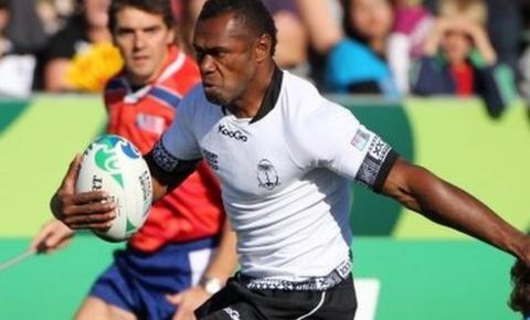 Fiji's Vereniki Goneva steps through the tackle of Namibia's Conrad Marais