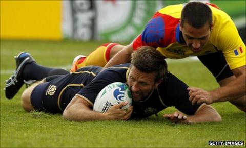 Simon Danielli crashes over for a try against Romania