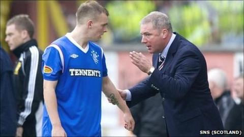 Rangers manager Ally McCoist passes on instructions to Gregg Wylde