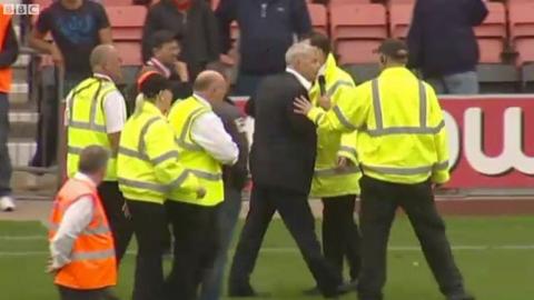 Bournemouth chairman Eddie Mitchell confronts the fans