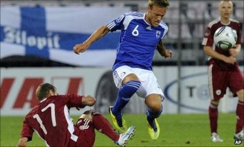 Latvia's Edgars Gauracs (l) challenges Mika Vayrynen of Finland