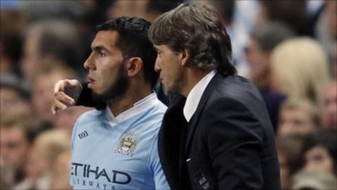 Carlos Tevez and Roberto Mancini