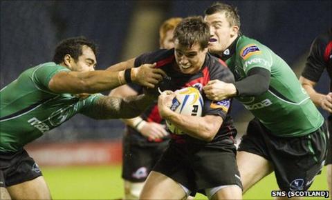 Edinburgh's Lee Jones is tackled by two Connacht players