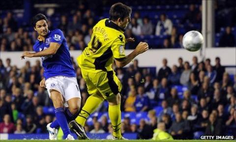 Mikel Arteta (left) scores against Sheffield United