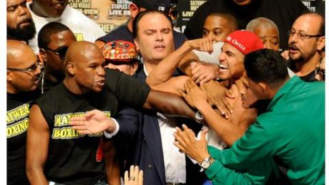 Floyd Mayweather Jnr (left) and Victor Ortiz (right)