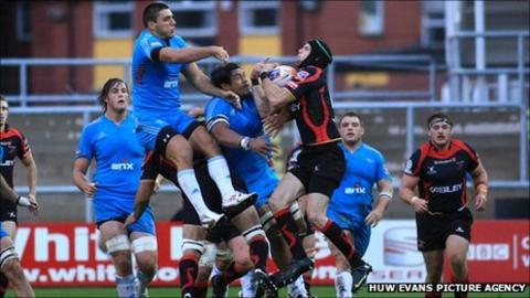 Dragons' Michael Poole outjumps the Aironi defence to claim high ball