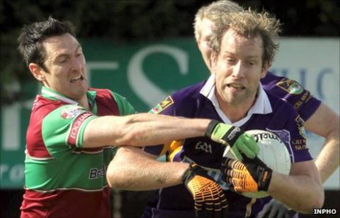 Coleraine's Mark McTaggart and Kilmacud's Brian Kavanagh
