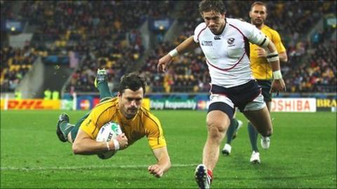 Adam Ashley-Cooper dives over to score Australia's seventh try