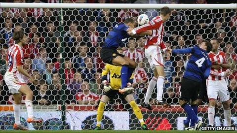 Peter Crouch heads Stoke City level against Manchester United
