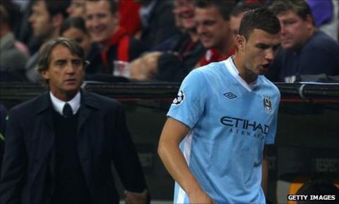 Edin Dzeko reacts angrily after being substituted