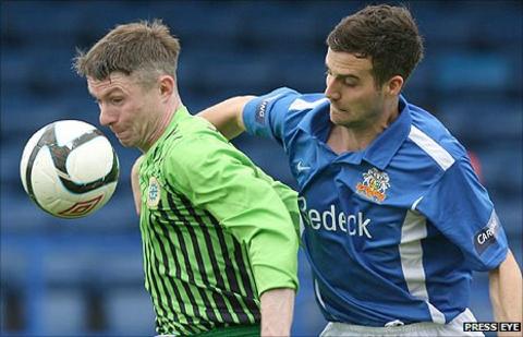 Paul McVeigh of Donegal Celtic in action against Glenavon's Mark Turkington