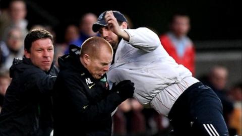 A fan attacks Celtic manager Neil Lennon at Tynecastle